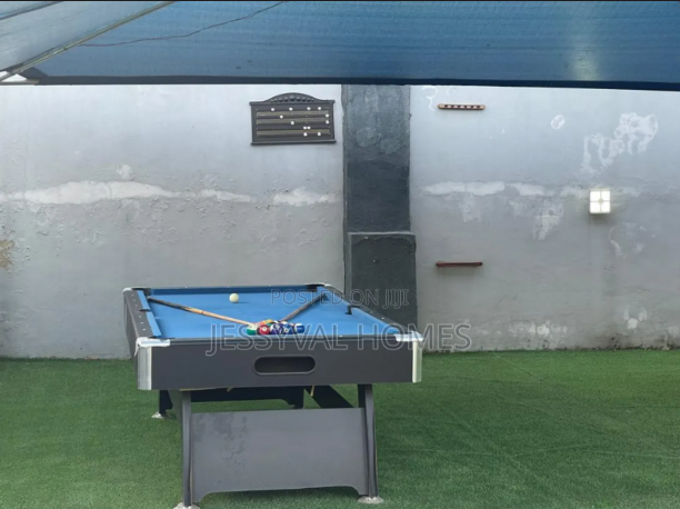 Family shortlet amenities in Abuja showing a snooker board